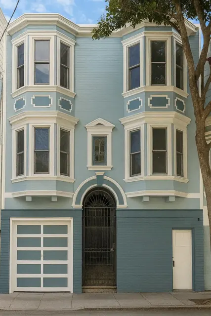 Repainted San Francisco Victorian, blue-grey with cream trim