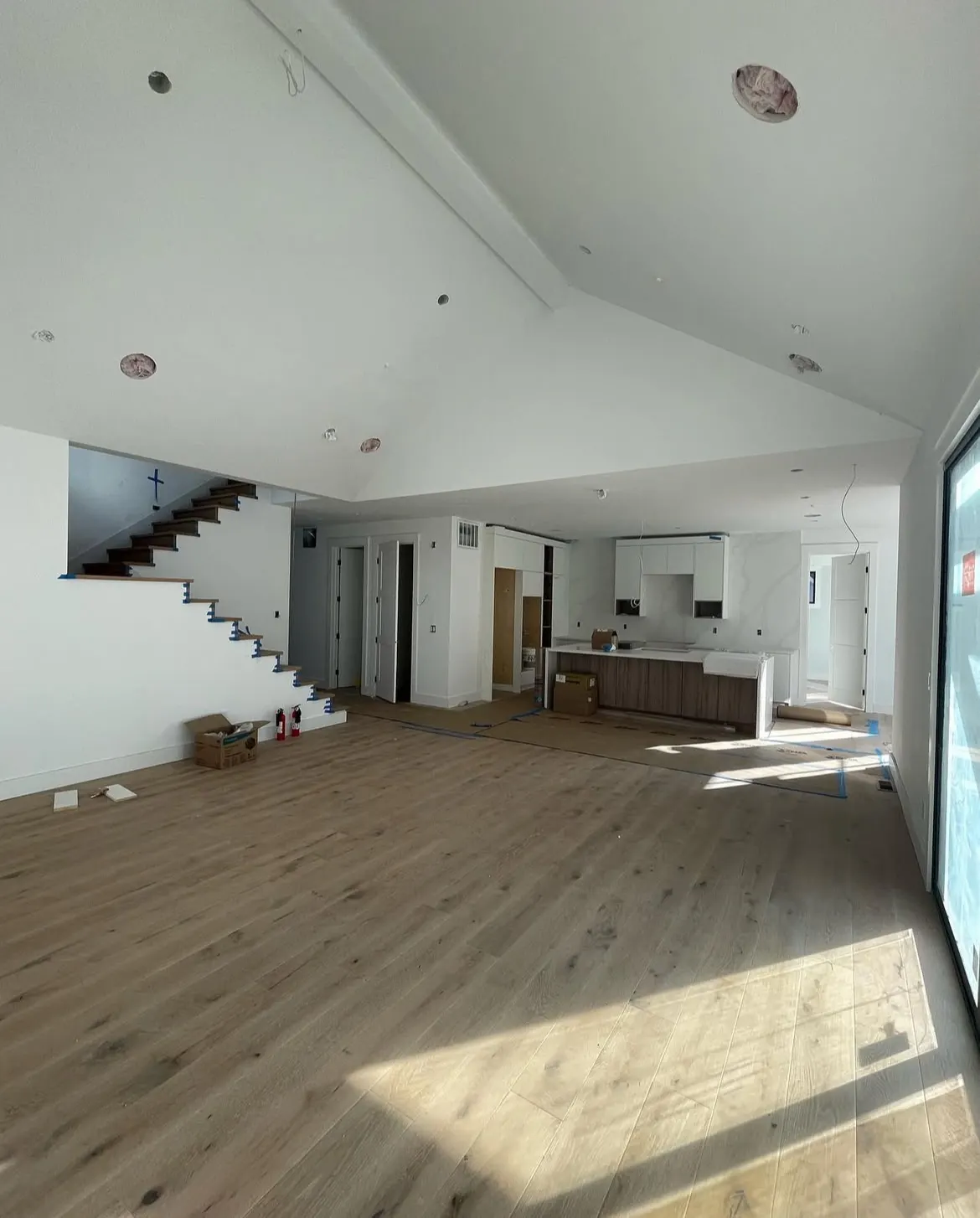 Living room and kitchen, freshly painted white